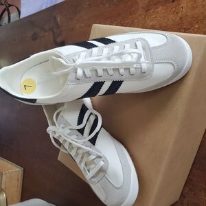 White and Black Low-Top Sneakers with Retro Design